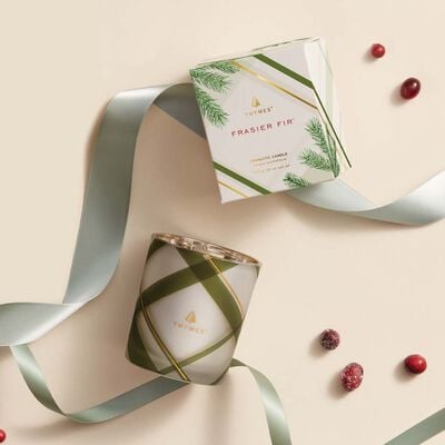 Thymes Frasier Fir Frosted Plaid Medium Candle is a Christmas Candle flat-lay with ribbon